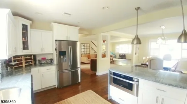 a kitchen with refrigerator and countertop