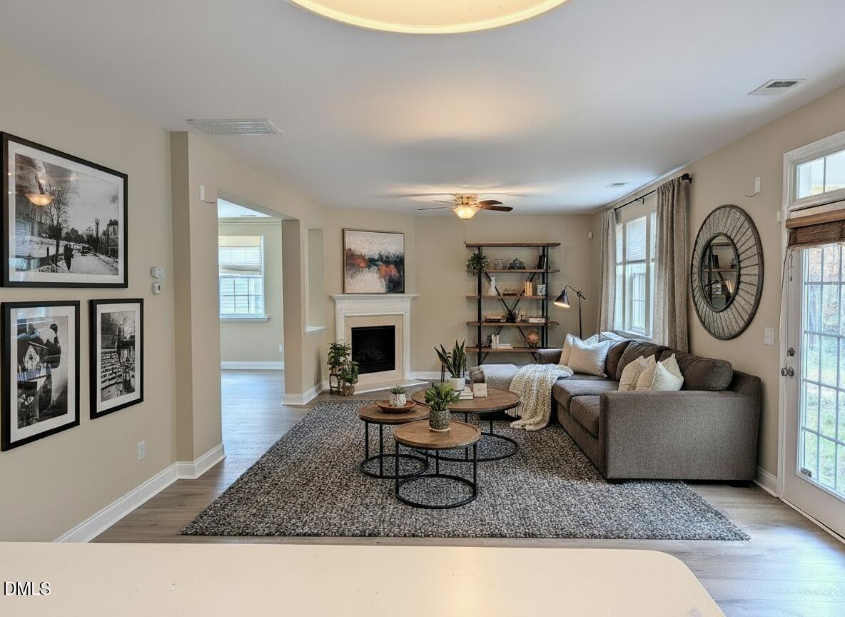 314 Ashburn Lane Durham, NC 27703 - Photo 14 of 40 a living room with furniture a rug and a fireplace