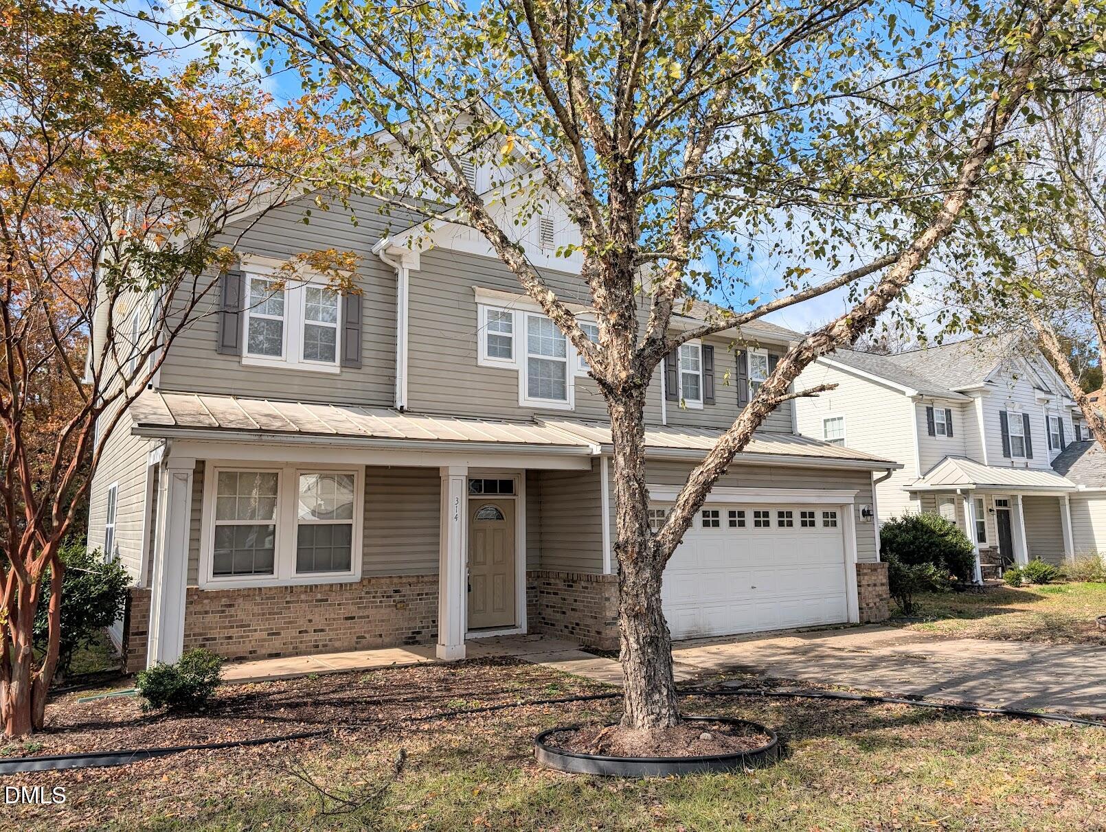 314 Ashburn Lane Durham, NC 27703 - Photo 2 of 40 a front view of a house with a yard