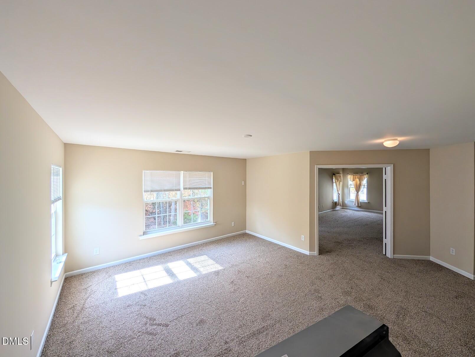 314 Ashburn Lane Durham, NC 27703 - Photo 21 of 40 an empty room with windows and closet