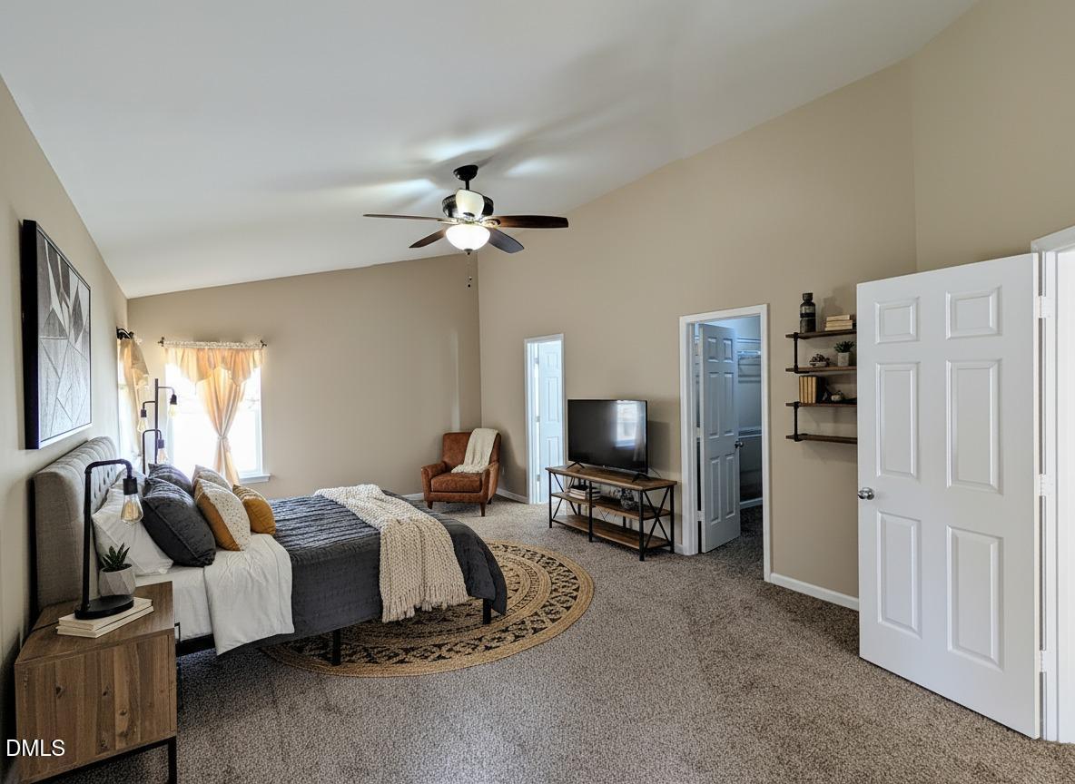 314 Ashburn Lane Durham, NC 27703 - Photo 24 of 40 a bedroom with furniture and a flat screen tv