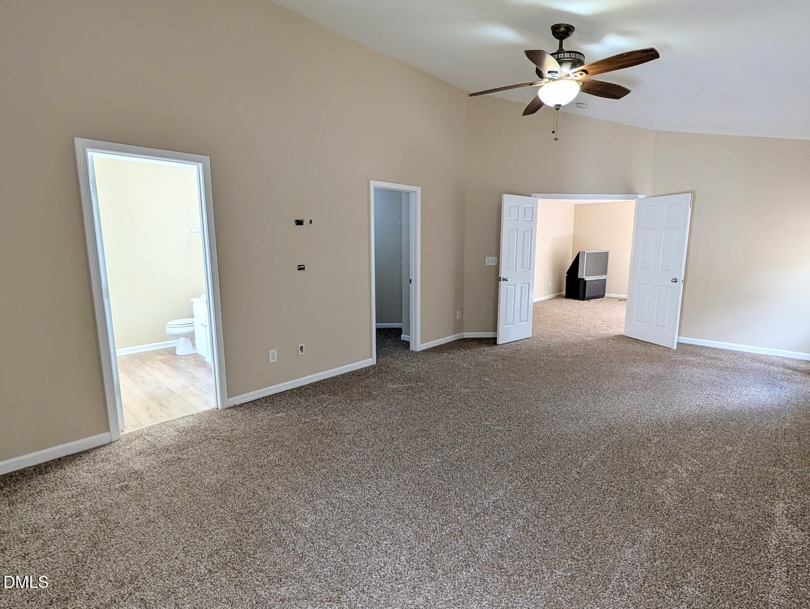 314 Ashburn Lane Durham, NC 27703 - Photo 26 of 40 a view of a big room with chandelier fan and windows