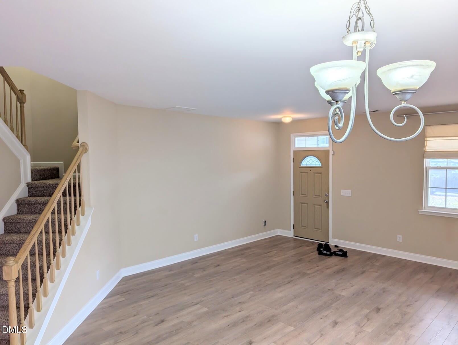 314 Ashburn Lane Durham, NC 27703 - Photo 5 of 40 a view of an empty room and wooden floor
