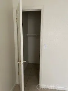 a toilet sitting in a bathroom next to a sink