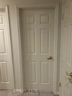 a view of an empty room with a fireplace