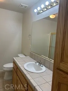 a bathroom with a sink and mirror