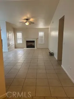 a view of an empty room with window and stairs