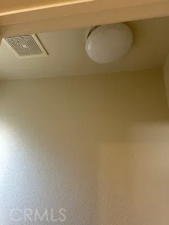 a bathroom with a granite countertop sink a mirror and shower