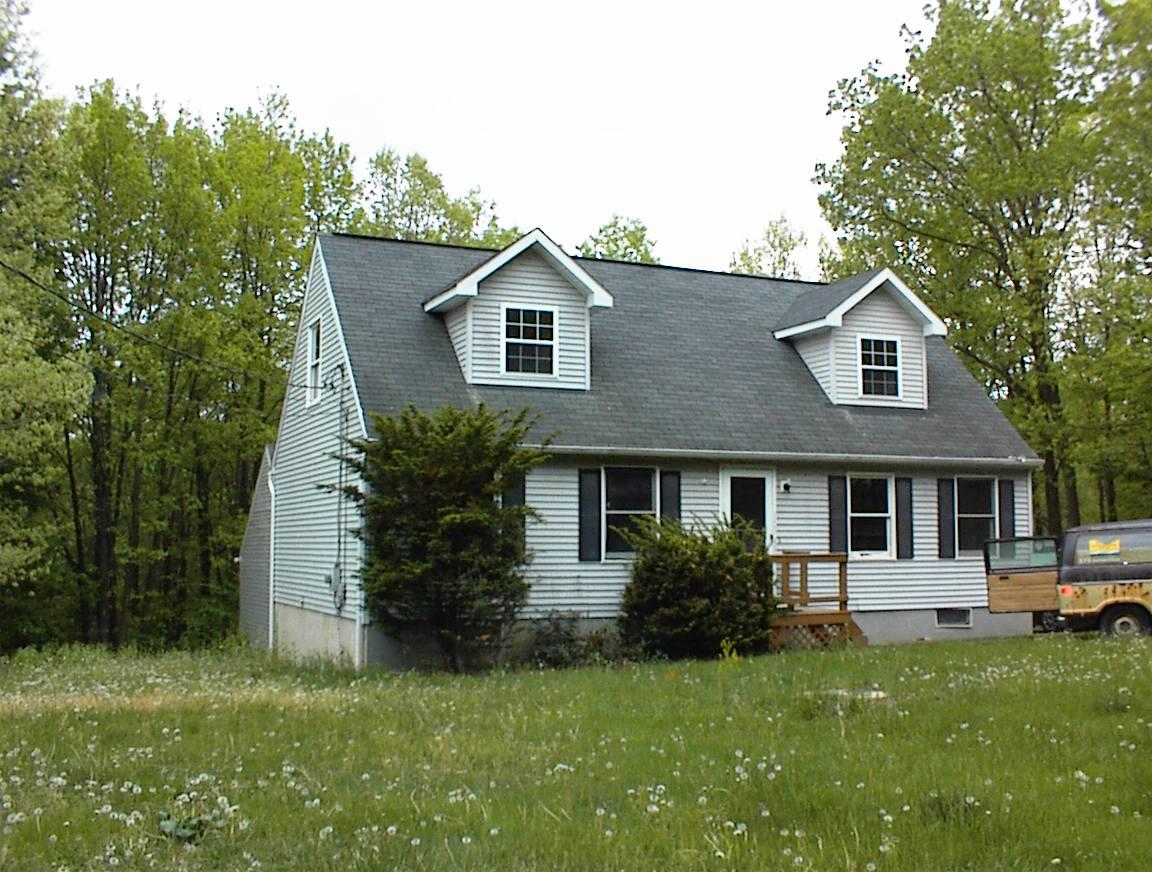 1626 David Road Effort, PA 18330 - Photo 1 of 1 a front view of a house with a yard and trees