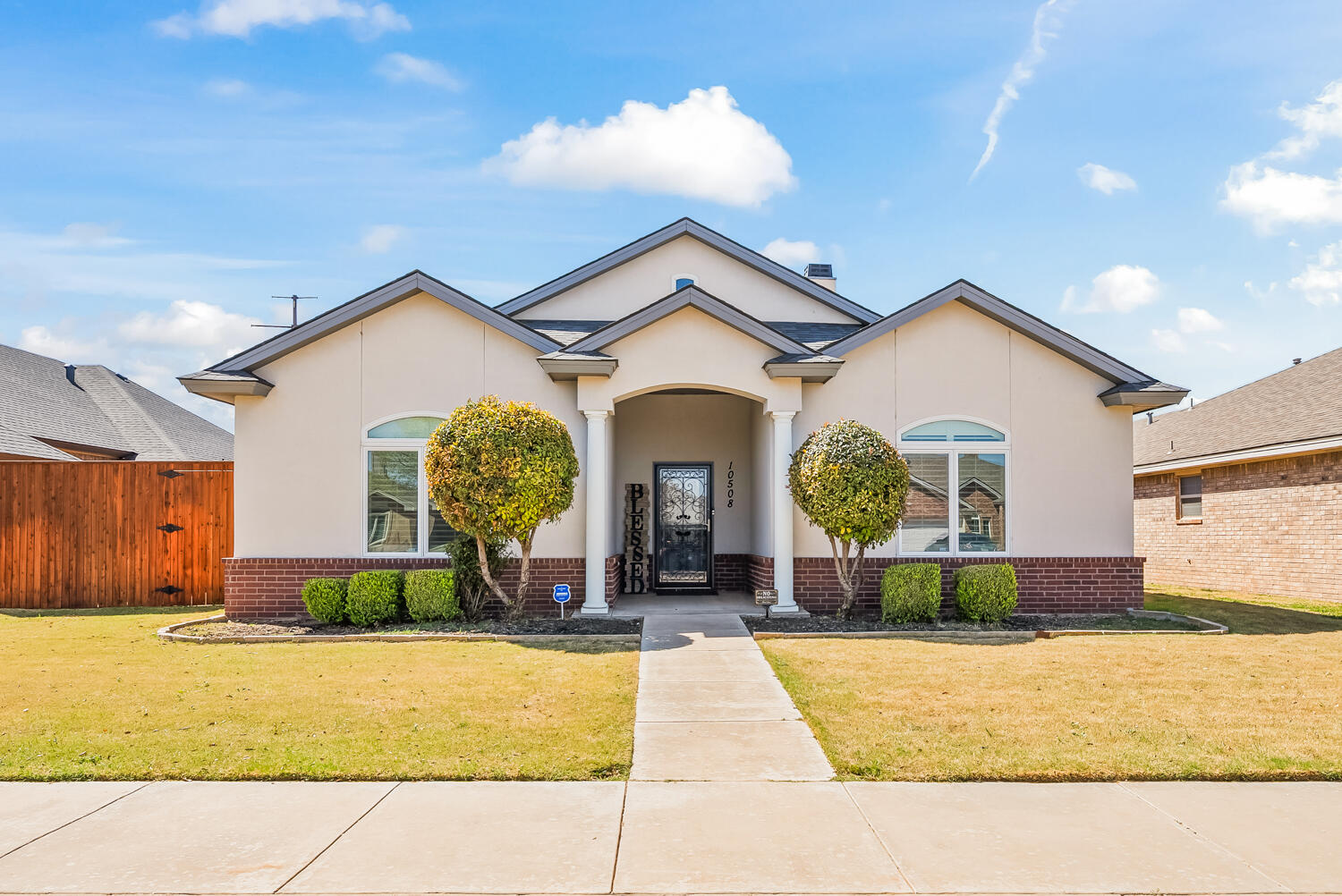 a view of a house with a swimming pool and a yard