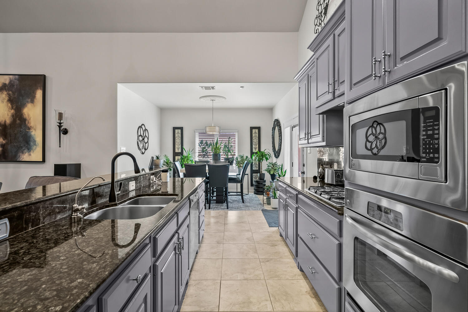 10508 Elgin Avenue Lubbock, TX 79423 - Photo 12 of 29 a kitchen with stainless steel appliances granite countertop a sink and cabinets