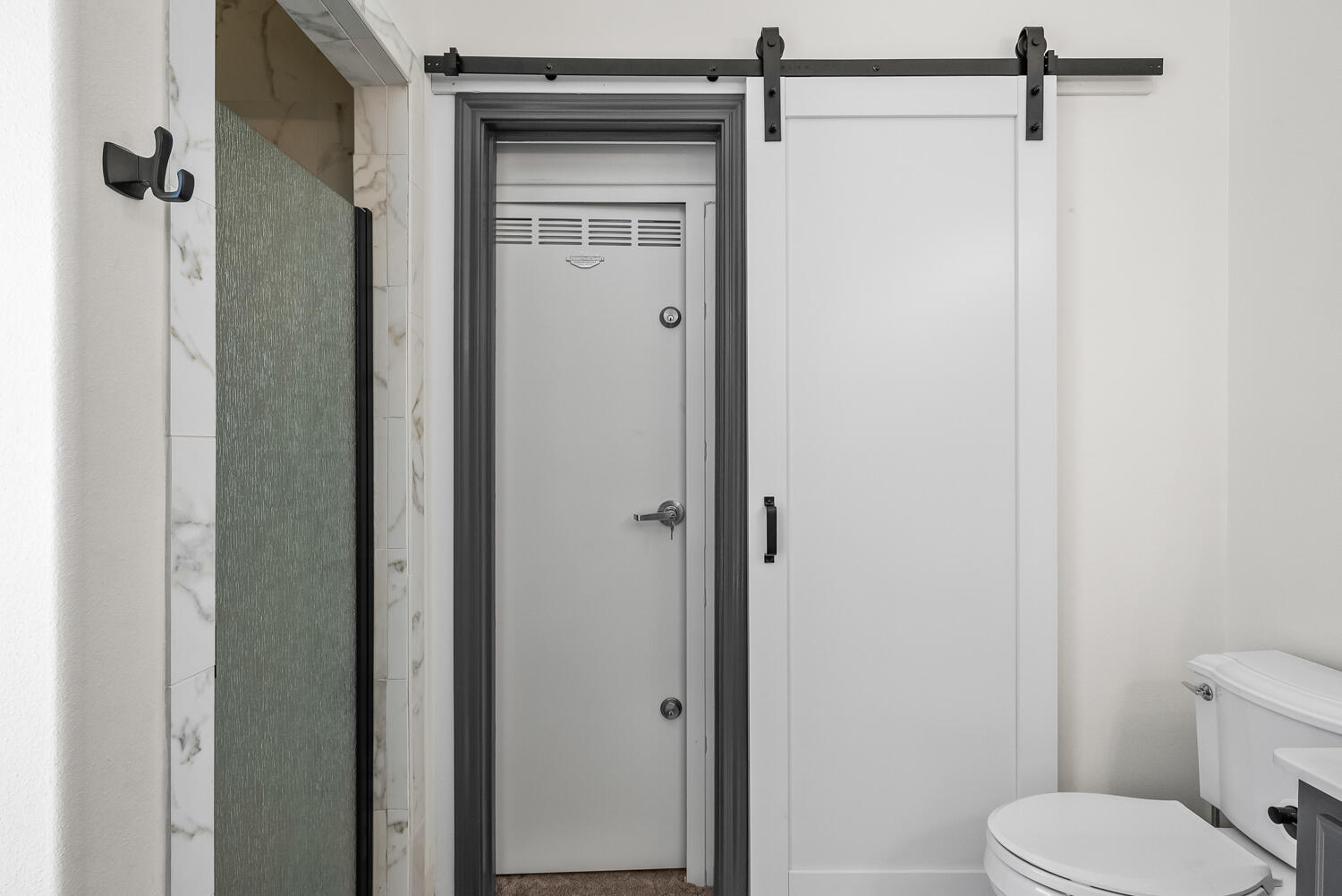 10508 Elgin Avenue Lubbock, TX 79423 - Photo 18 of 29 a bathroom with a toilet and a shower