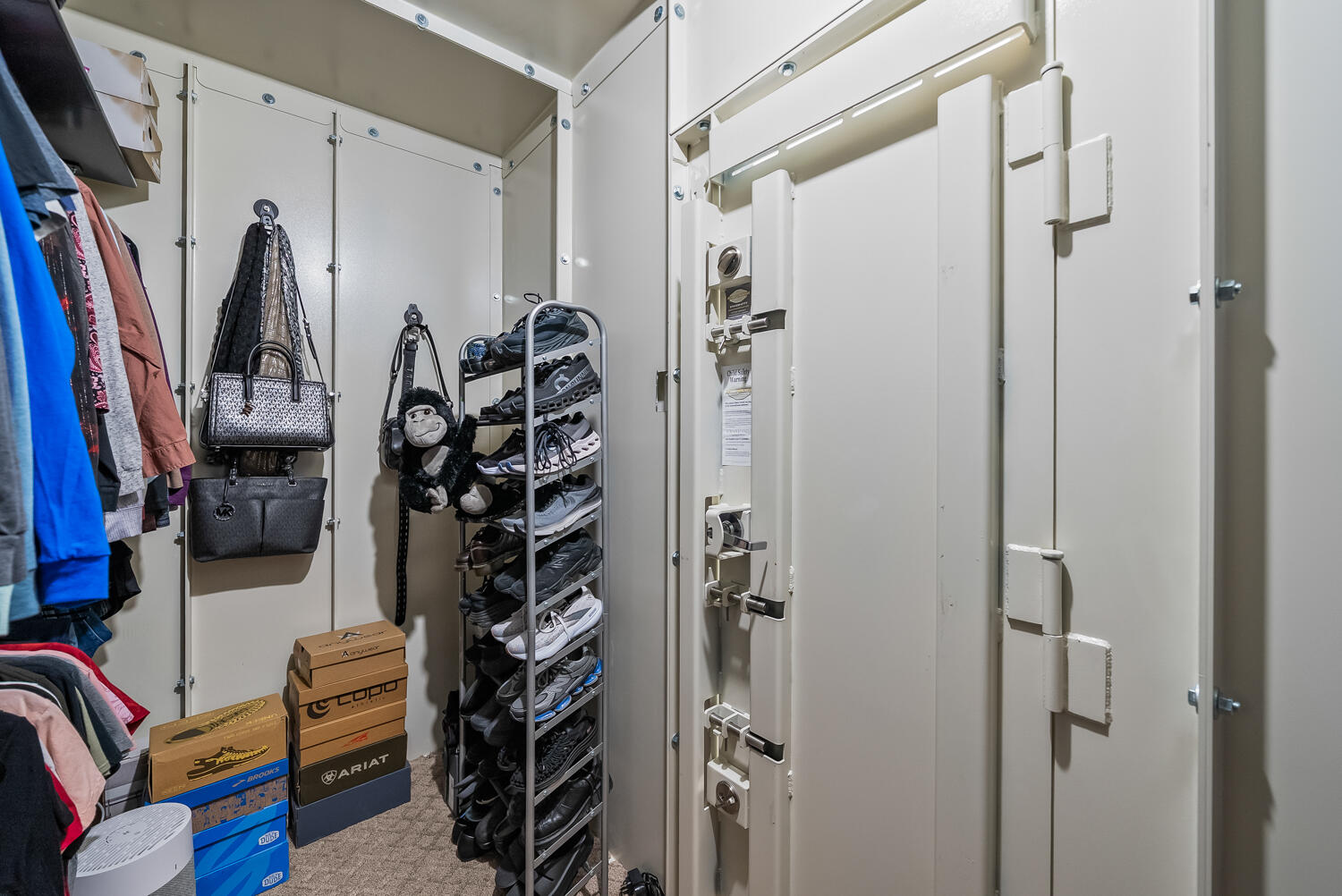 10508 Elgin Avenue Lubbock, TX 79423 - Photo 19 of 29 a view of walk in closet with clothes and shoes