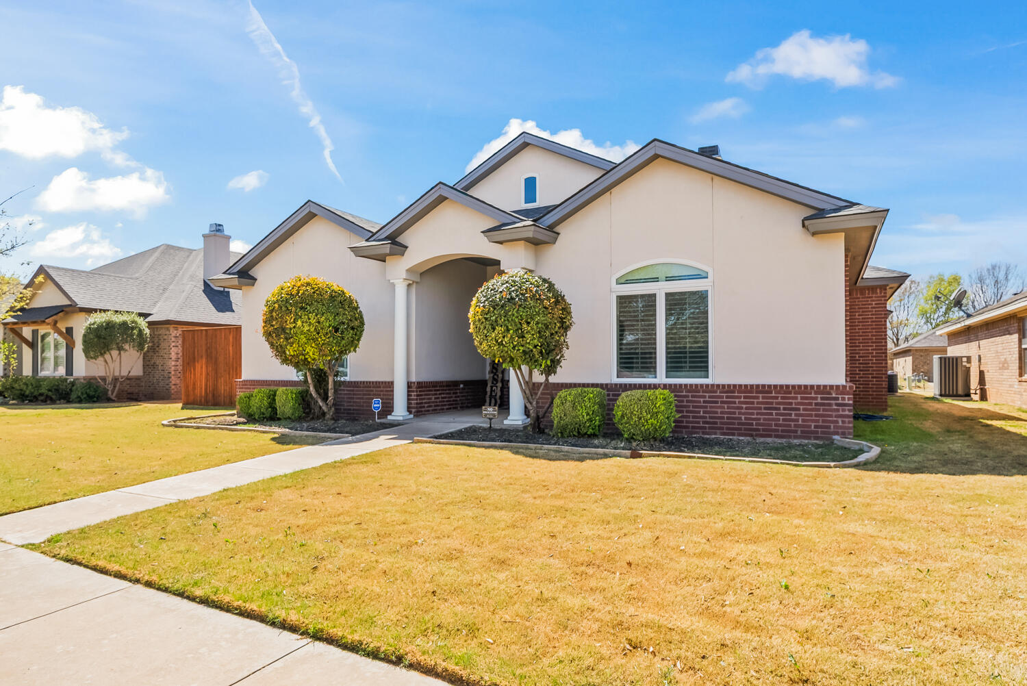 10508 Elgin Avenue Lubbock, TX 79423 - Photo 2 of 29 a view of a house with backyard and a tree