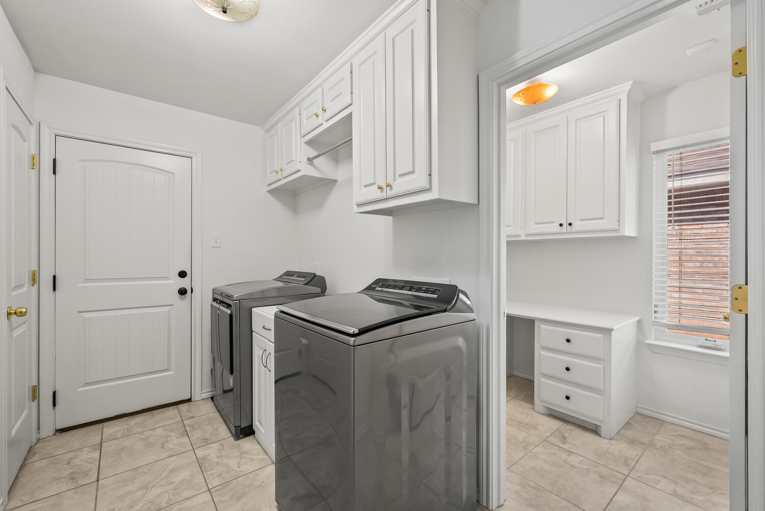 10508 Elgin Avenue Lubbock, TX 79423 - Photo 23 of 29 a kitchen with cabinets and stainless steel appliances