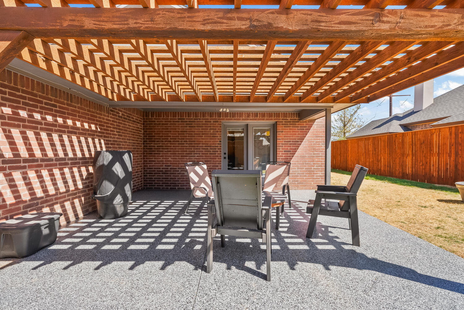 10508 Elgin Avenue Lubbock, TX 79423 - Photo 27 of 29 a view of a chairs and table in the patio