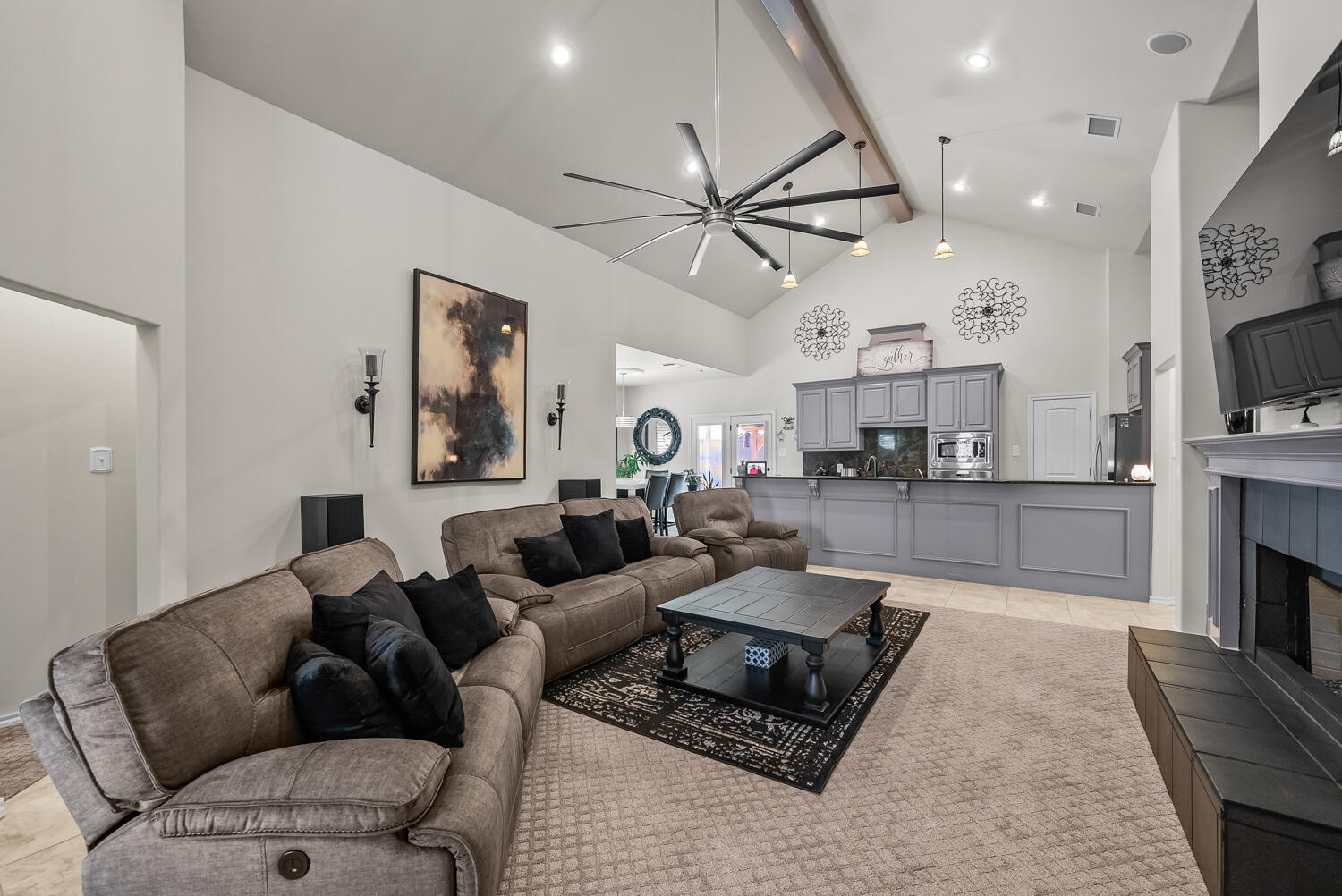 10508 Elgin Avenue Lubbock, TX 79423 - Photo 5 of 29 a living room with furniture and a fireplace