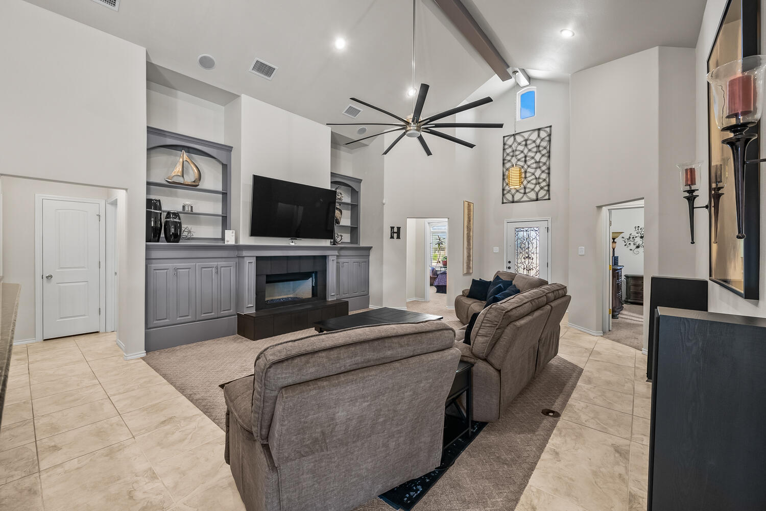 10508 Elgin Avenue Lubbock, TX 79423 - Photo 6 of 29 a living room with furniture and a flat screen tv