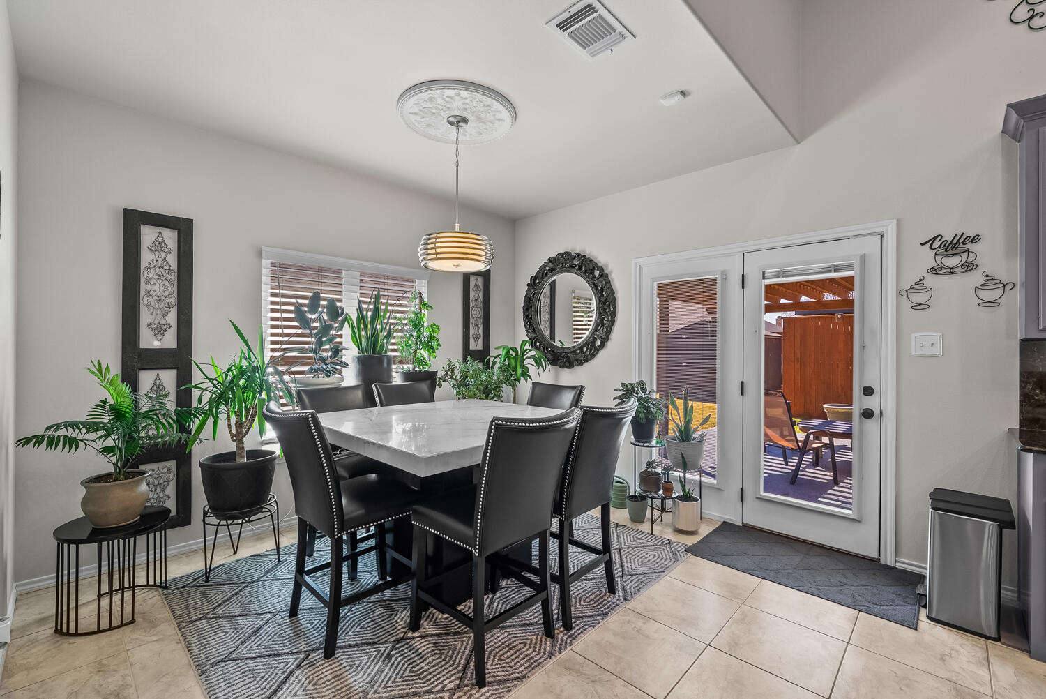 10508 Elgin Avenue Lubbock, TX 79423 - Photo 8 of 29 a view of a dining room and livingroom with furniture window and wooden floor