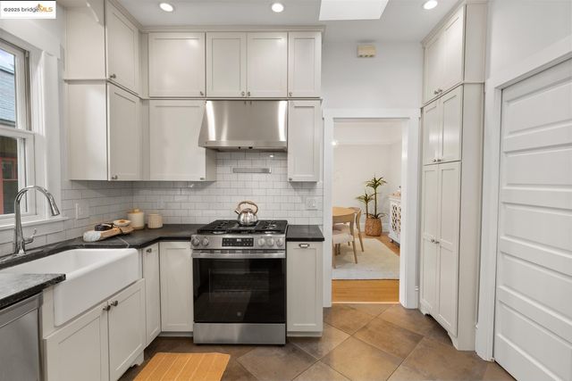 a kitchen with a stove and cabinets