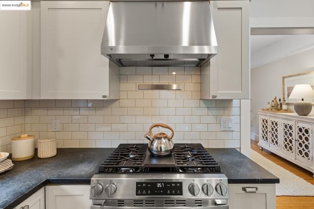 a close up of a stove top oven sitting inside of a kitchen