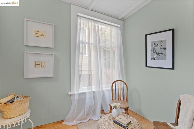 a view of a backyard with chairs and a patio
