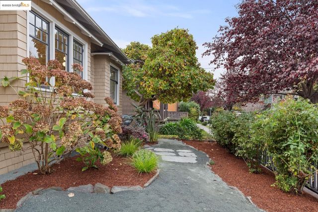 a pathway of a house with a yard