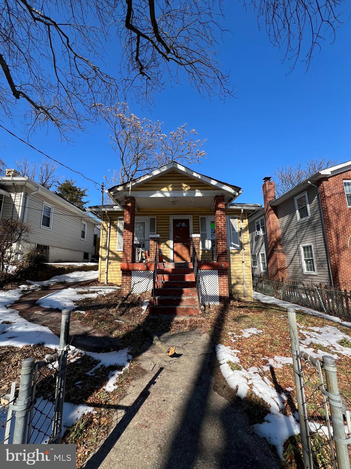 4530 Dix Street Northeast Washington, DC 20019 - Photo 1 of 23 a view of a patio with table and chairs under an umbrella