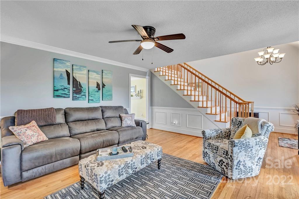331 Polk Ford Road Stanfield, NC 28163 - Photo 16 of 47 a living room with furniture and a chandelier