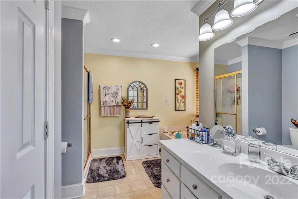 331 Polk Ford Road Stanfield, NC 28163 - Photo 19 of 47 a bathroom with a granite countertop sink mirror and vanity