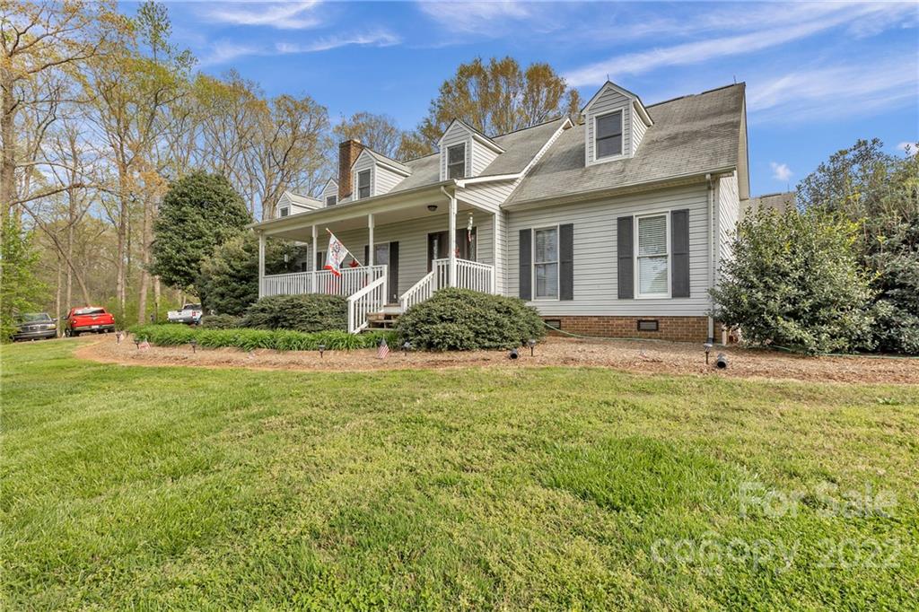 331 Polk Ford Road Stanfield, NC 28163 - Photo 2 of 47 a front view of a house with a yard