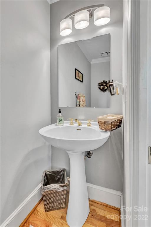 331 Polk Ford Road Stanfield, NC 28163 - Photo 23 of 47 a bathroom with a sink and a mirror