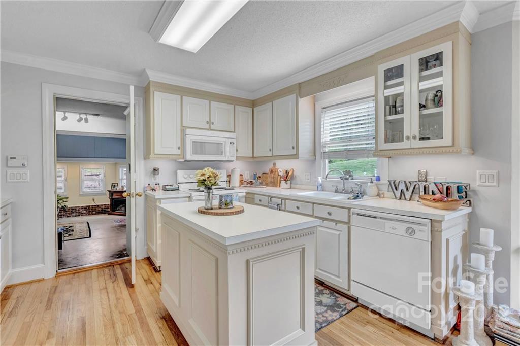 331 Polk Ford Road Stanfield, NC 28163 - Photo 28 of 47 a kitchen with a sink stove and cabinets
