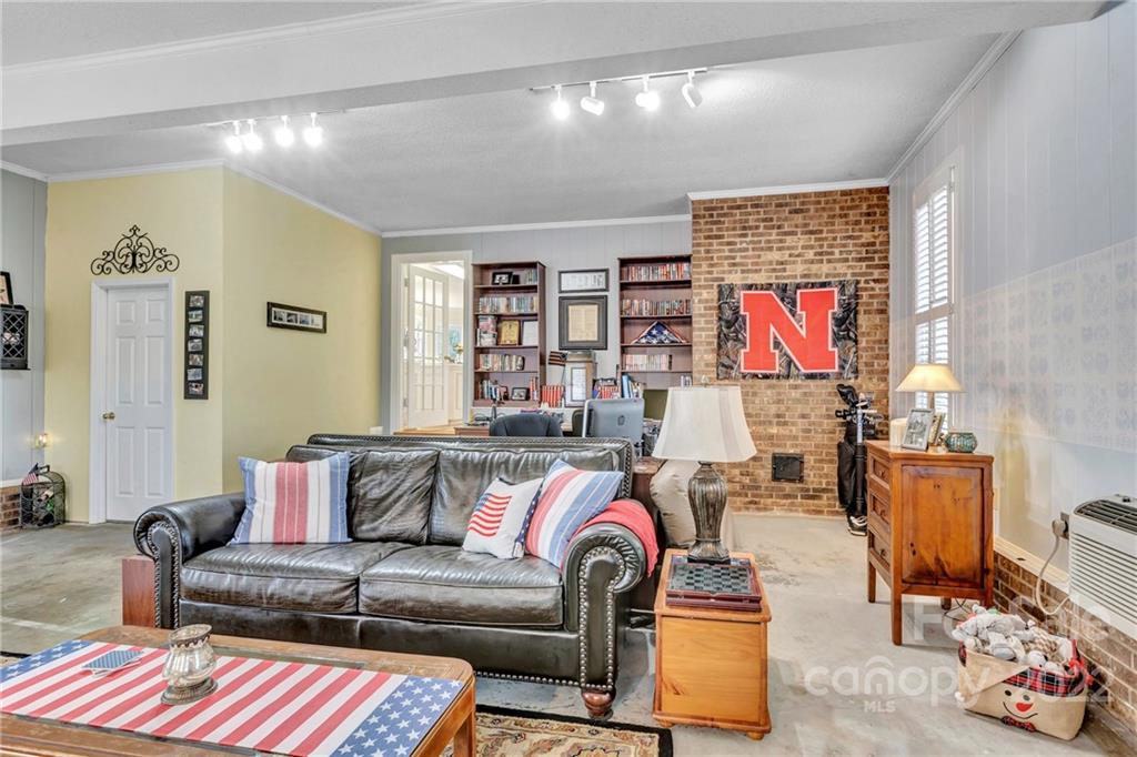 331 Polk Ford Road Stanfield, NC 28163 - Photo 31 of 47 a living room with furniture and a window