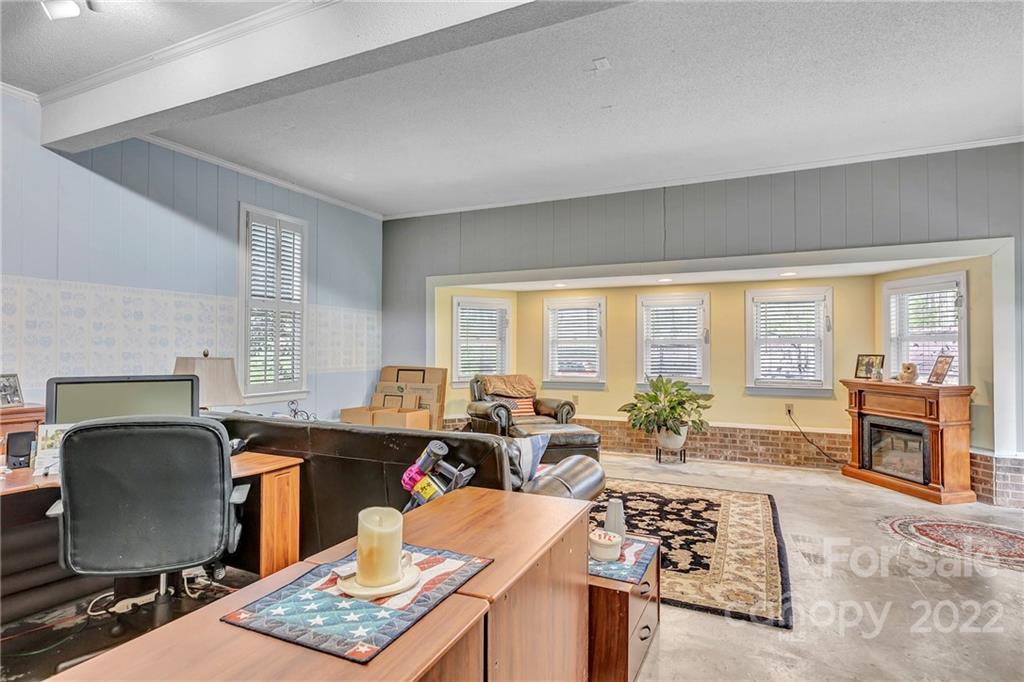 331 Polk Ford Road Stanfield, NC 28163 - Photo 32 of 47 a workspace with furniture and a window