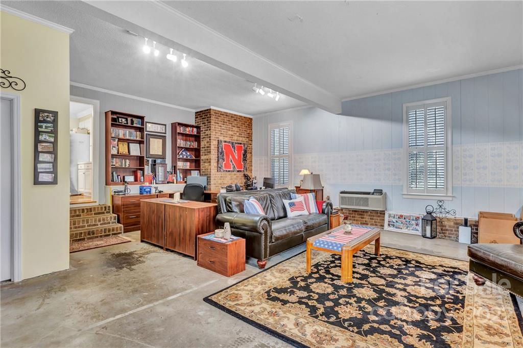 331 Polk Ford Road Stanfield, NC 28163 - Photo 33 of 47 a living room with furniture rug and window