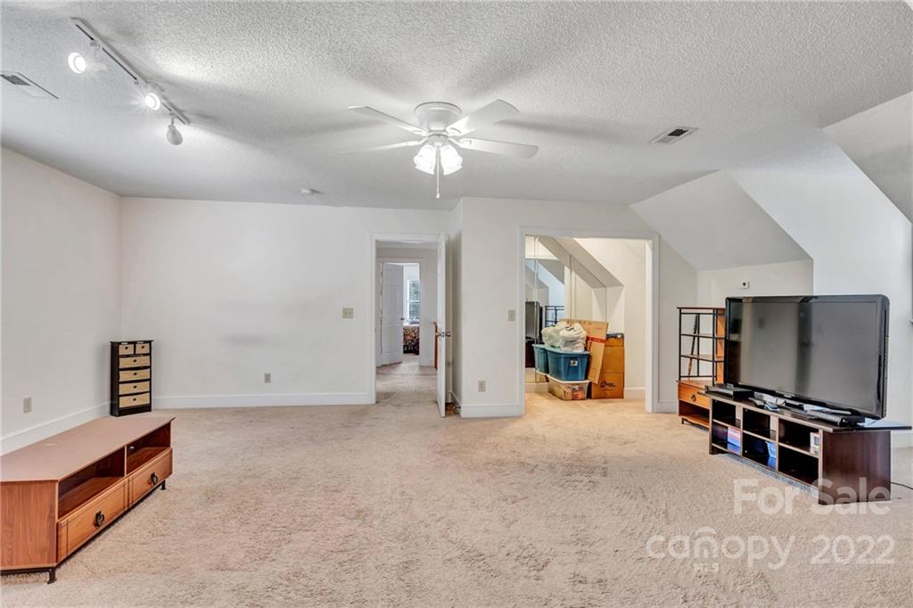 331 Polk Ford Road Stanfield, NC 28163 - Photo 36 of 47 a view of a livingroom with furniture and a flat screen tv
