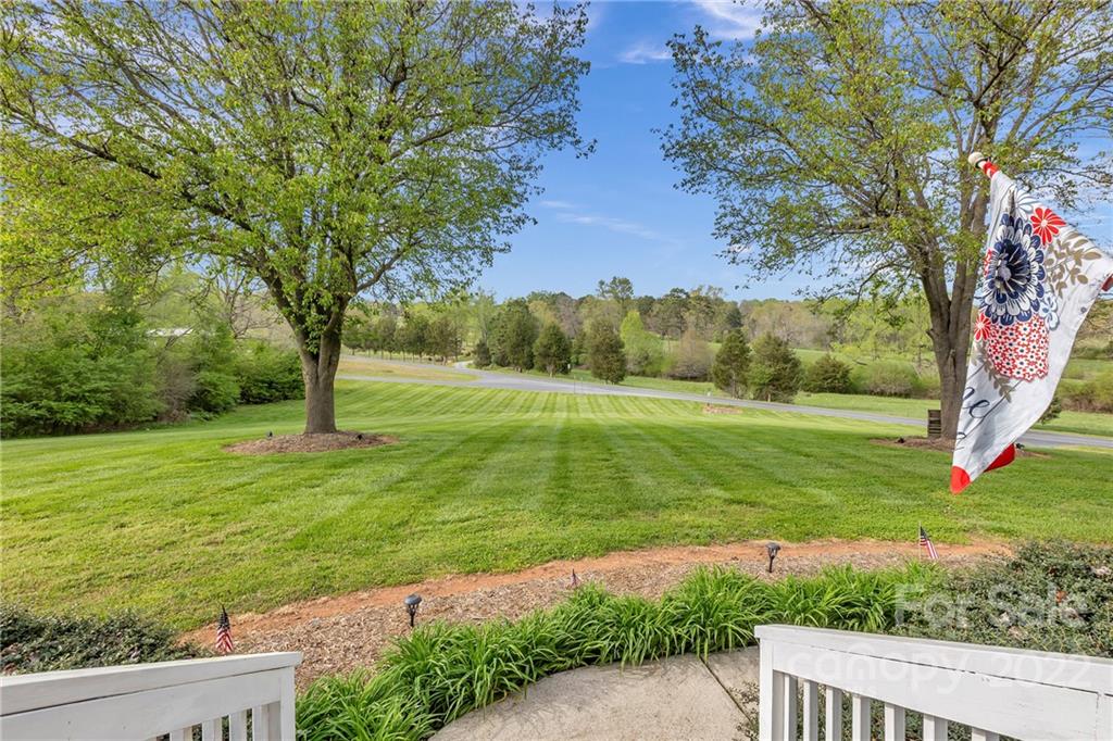 331 Polk Ford Road Stanfield, NC 28163 - Photo 4 of 47 a view of a garden with a tree
