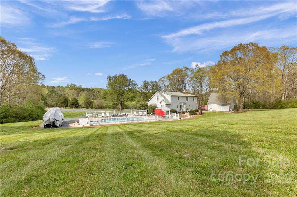331 Polk Ford Road Stanfield, NC 28163 - Photo 6 of 47 a view of a house with a big yard