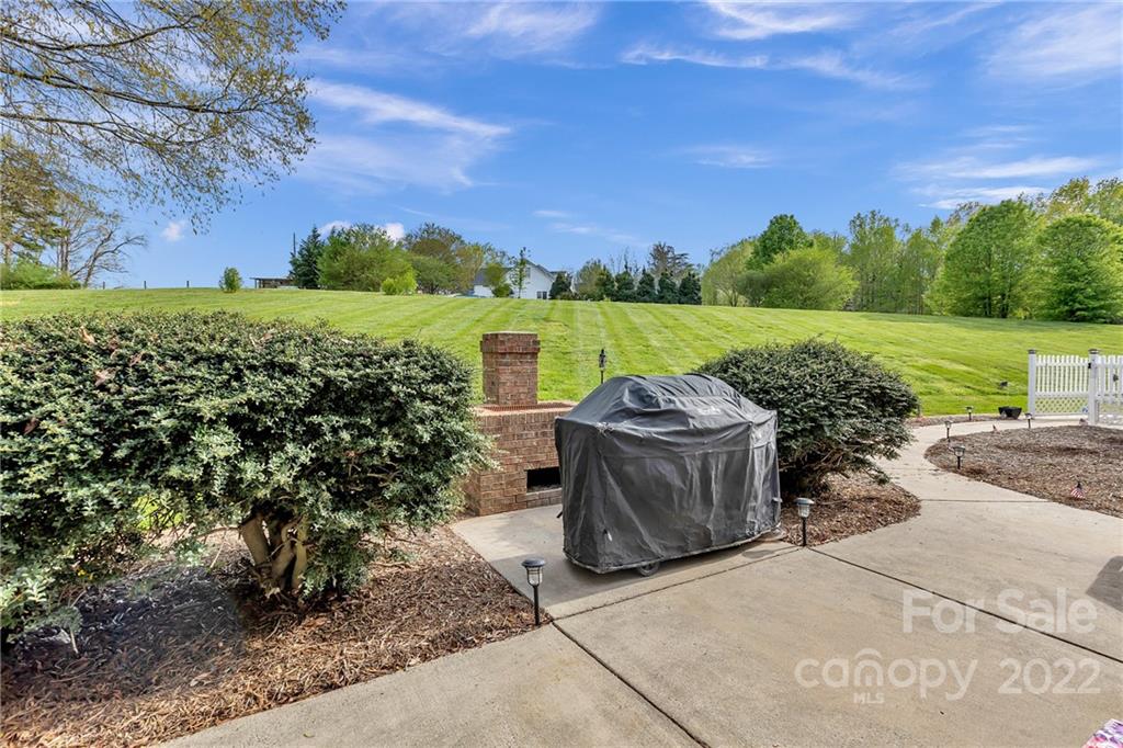 331 Polk Ford Road Stanfield, NC 28163 - Photo 10 of 47 a view of a lake with a building in the background