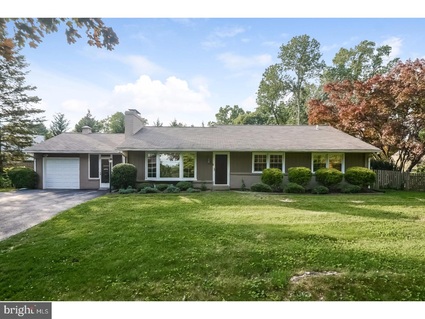 105 Beatty Road Media, PA 19063 - Photo 1 of 25 a front view of a house with a garden