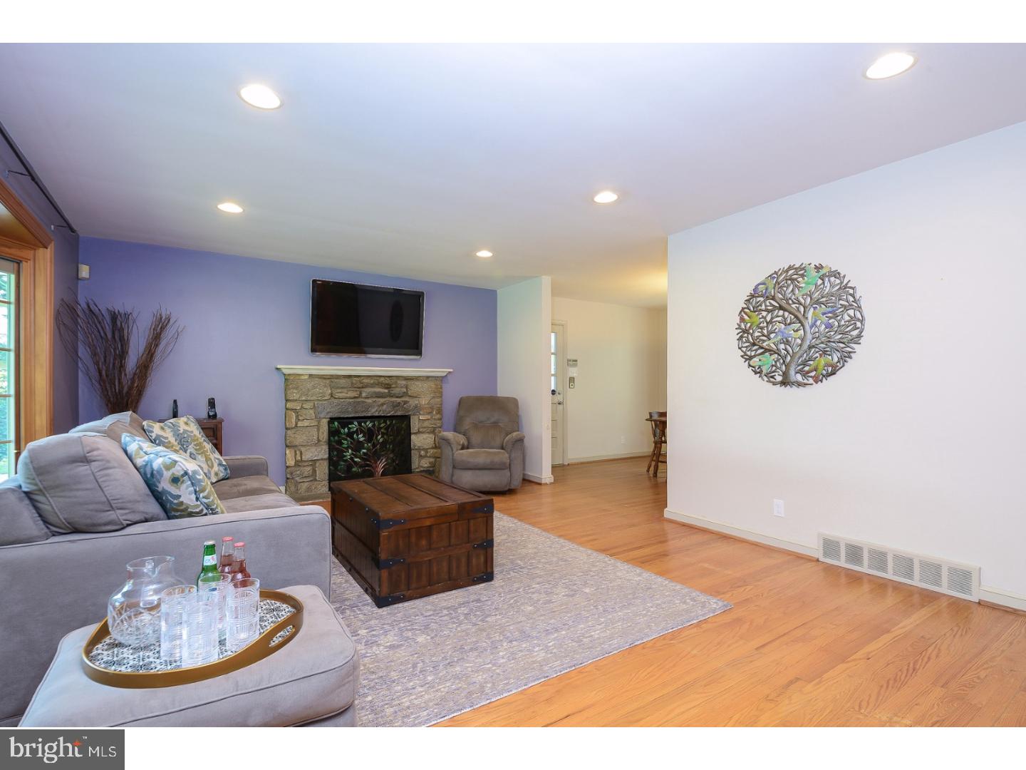 105 Beatty Road Media, PA 19063 - Photo 3 of 25 a living room with furniture and a fireplace