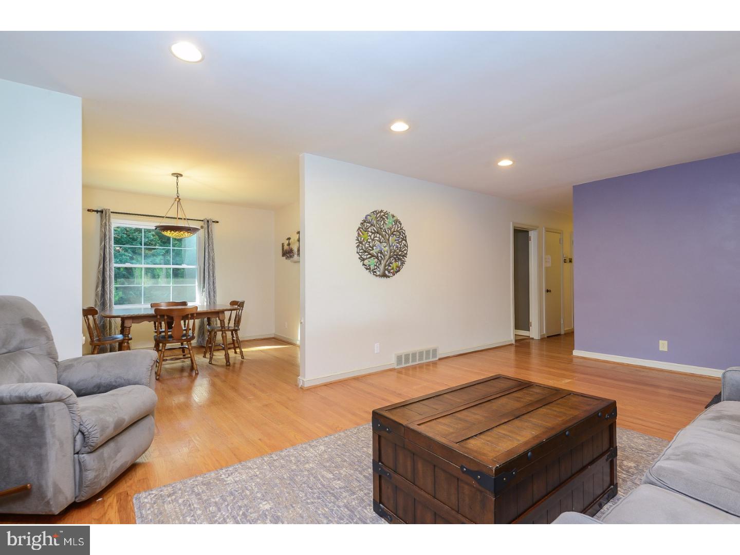 105 Beatty Road Media, PA 19063 - Photo 5 of 25 a living room with furniture and a large window