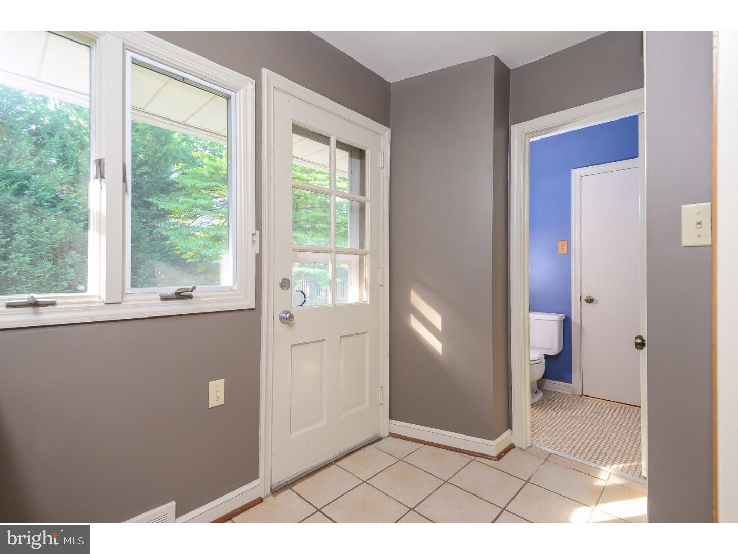 105 Beatty Road Media, PA 19063 - Photo 7 of 25 a view of an empty room with a window