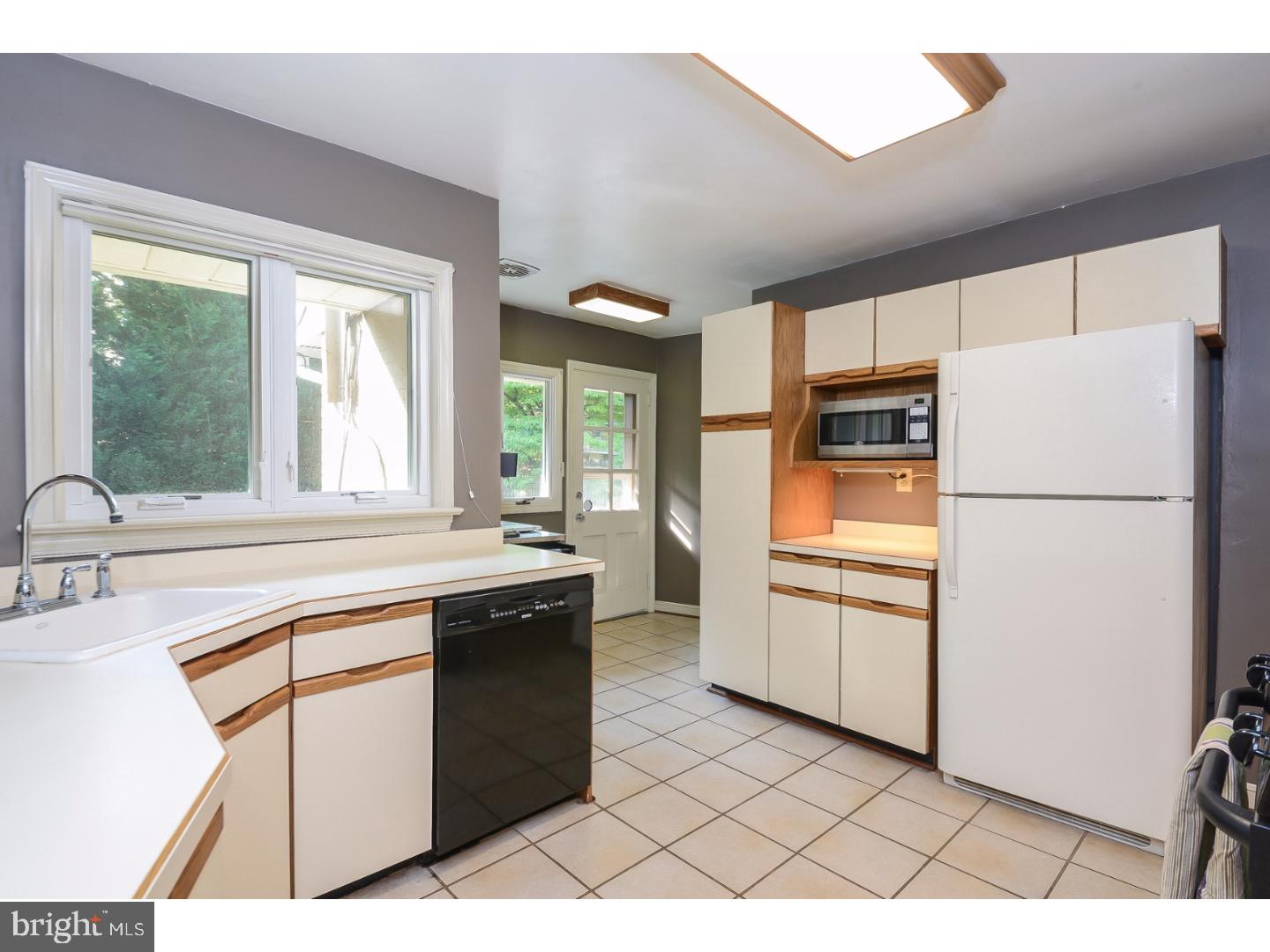 105 Beatty Road Media, PA 19063 - Photo 9 of 25 a kitchen with stainless steel appliances a refrigerator sink and cabinets