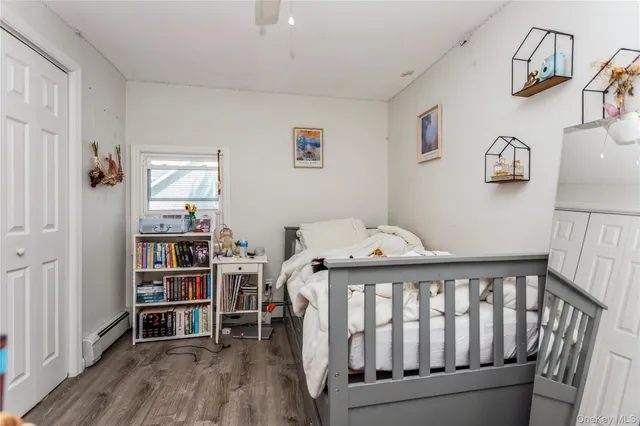 a bedroom with a bed and a bookshelf