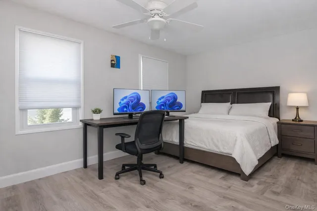 a bedroom with a bed and a table in it