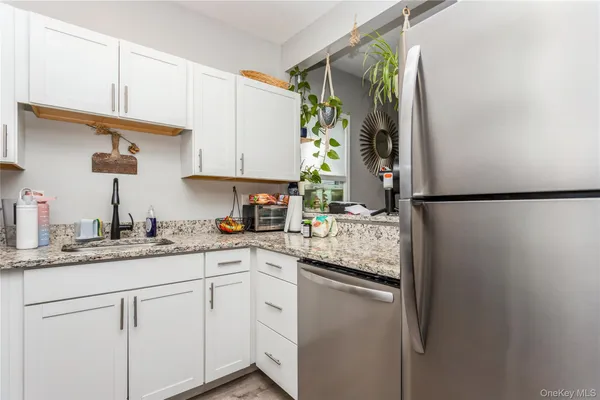 a kitchen with a sink and a refrigerator