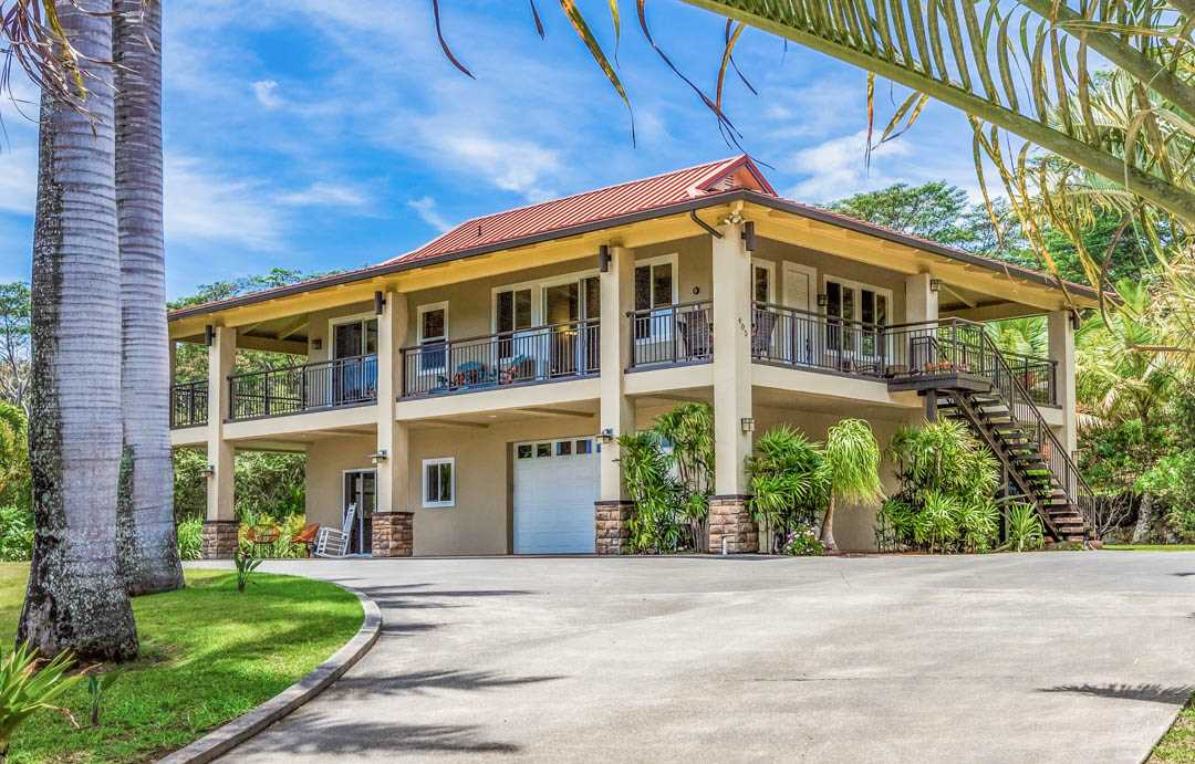 405 East Kuiaha Road Haiku, HI 96708 - Photo 1 of 30 a front view of a building with a garden and plants