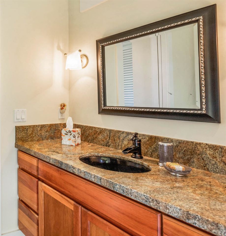 405 East Kuiaha Road Haiku, HI 96708 - Photo 17 of 30 a bathroom with a sink and a mirror